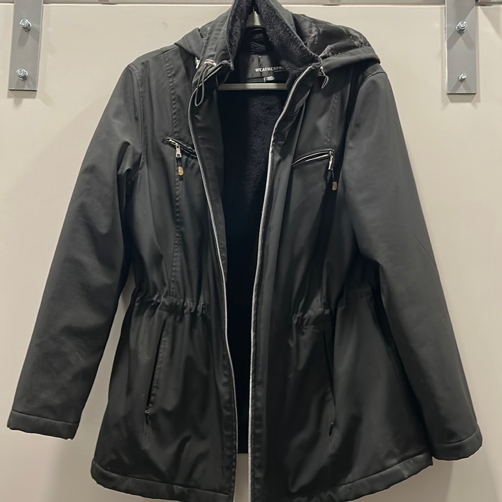Weatherproof black winter coat with hood and faux fur lining